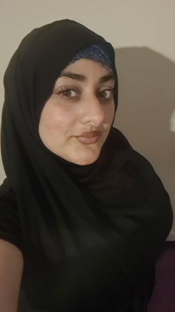 Friendly Massage Therapist Preparing for Session